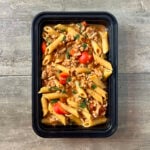 One Pot Sausage and Pepper Pasta in black meal prep container.