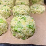 Broccoli cheddar rice portioned out on a sheet pan.