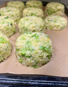 Broccoli cheddar rice portioned out on a sheet pan.